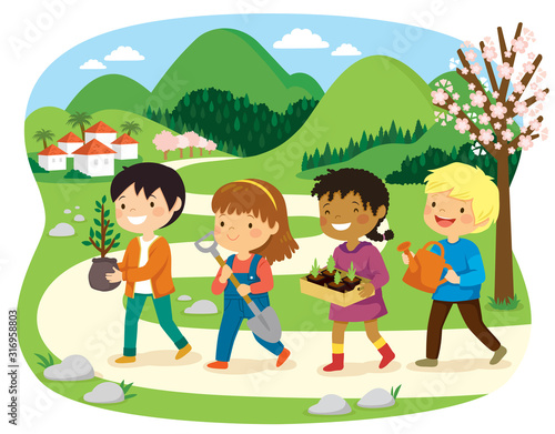 Israeli holiday of Tu Bishvat. Kids planting trees in a green rural area with blooming almond trees.
