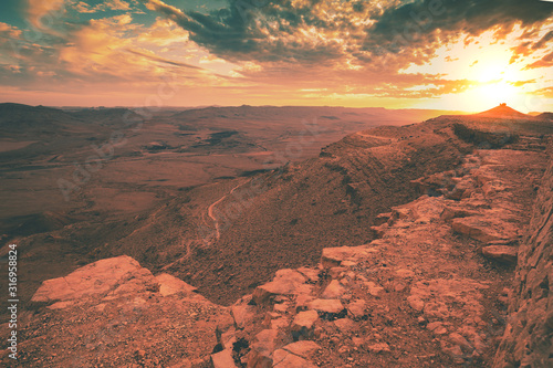 Beautiful dramatic sunset over the desert. Nature landscape. Makhtesh Ramon Crater, Israel