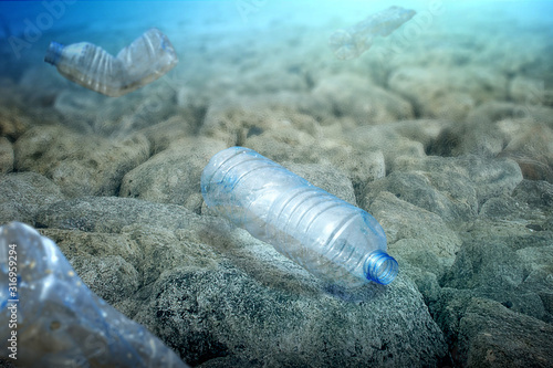 Underwater view with a plastic bottle on the ocean