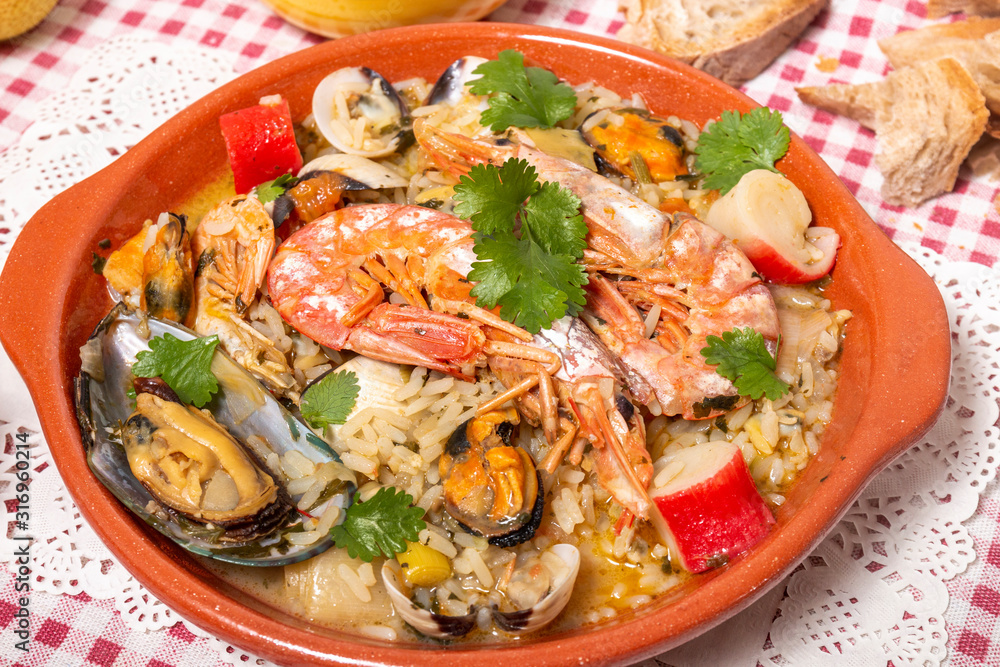 Traditional homemade meal of rice and seafood. Traditional homemade meal of rice and seafood.
