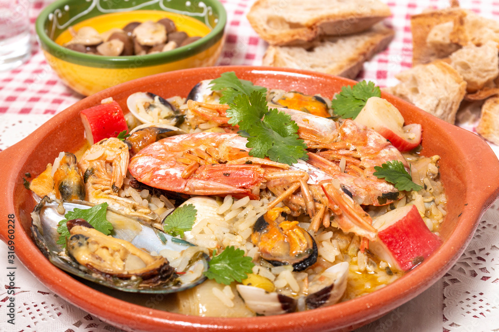 Traditional homemade meal of rice and seafood.