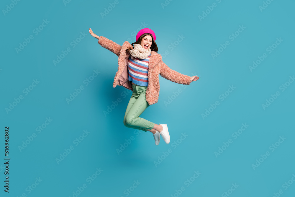 Full length body size view of nice fashionable attractive crazy cheerful cheery girlish girl jumping having fun fooling isolated on bright vivid shine vibrant green blue turquoise color background Full length body size view of nice fashionable attractive crazy cheerful cheery girlish girl jumping having fun fooling isolated on bright vivid shine vibrant green blue turquoise color background