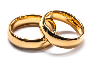 Gold wedding rings on white
