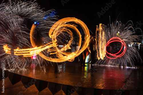 Fire Show Flaming Trails on stage slow shutter exciting event concept space for text