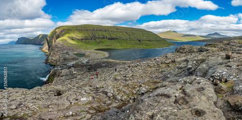 Fototapeta Naklejka Na Ścianę i Meble -  Bosdalafossur waterfall and coastline huge panorama, Faroe Islands