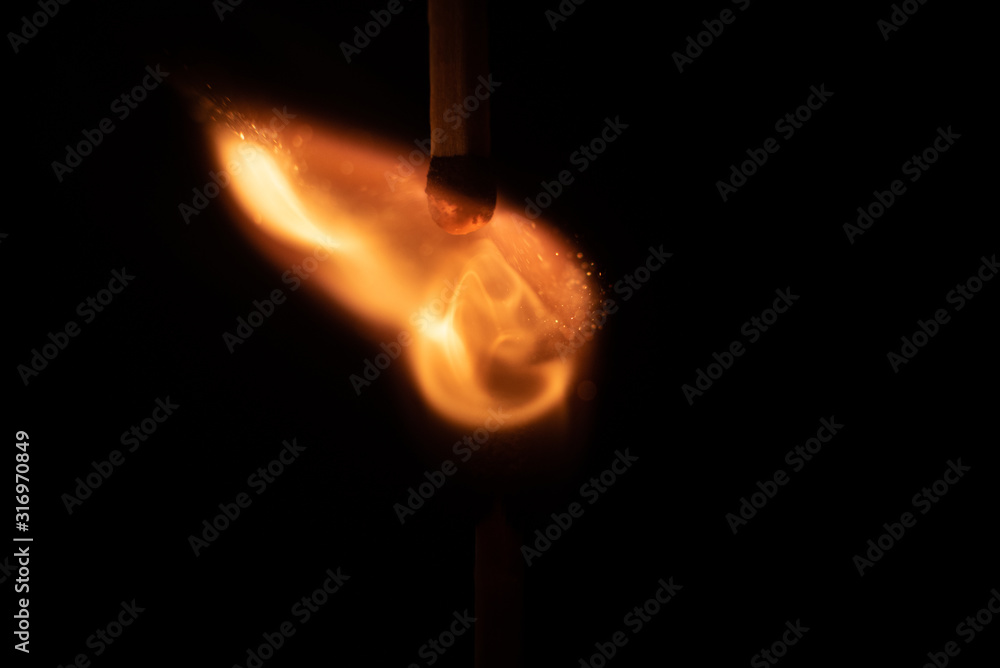 Ignition of match with sparks isolated on black background space for text fire concept passion figures variety Ignition of match with sparks isolated on black background space for text fire concept passion figures variety