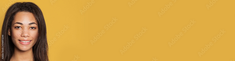 Beautiful young dark-skinned woman face closeup Beautiful young dark-skinned woman face closeup