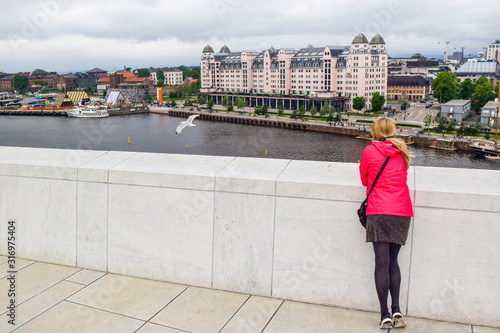 The girl on the roof of Oslo Opera House. Norway. photo