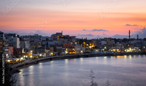 sunset light relflections in the bay of chania on the greek island of crete