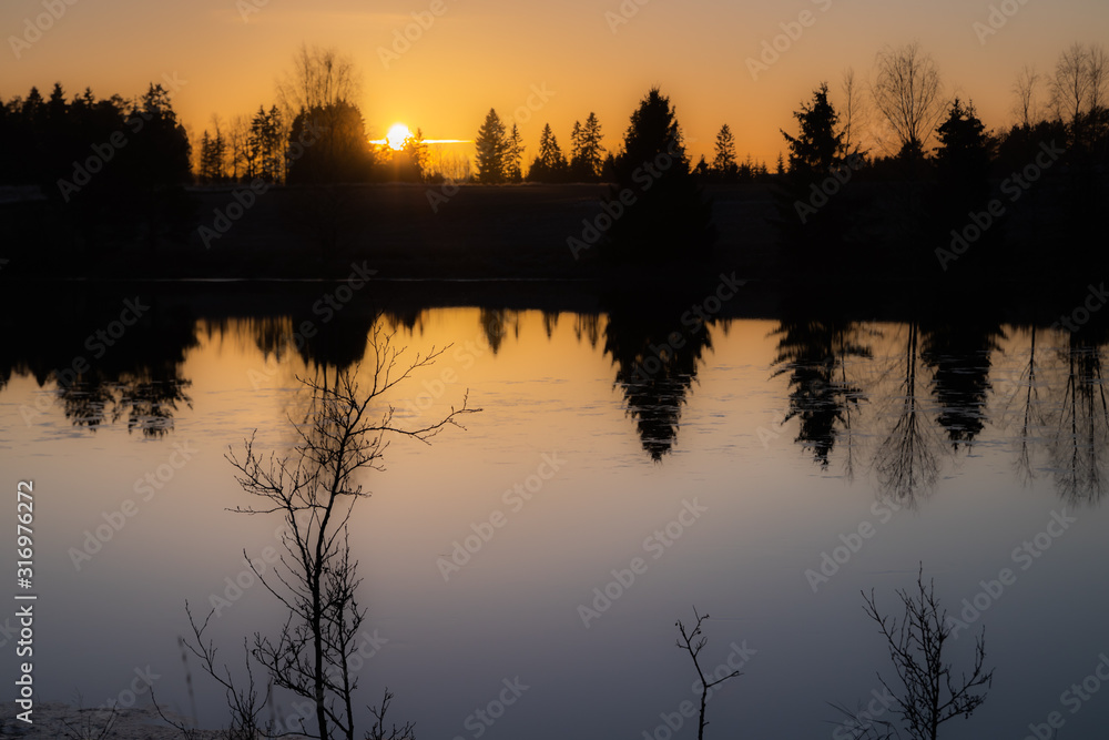 Beautiful sunset on river Kymijoki at winter, Finland.