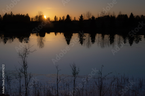 Beautiful sunset on river Kymijoki at winter, Finland.