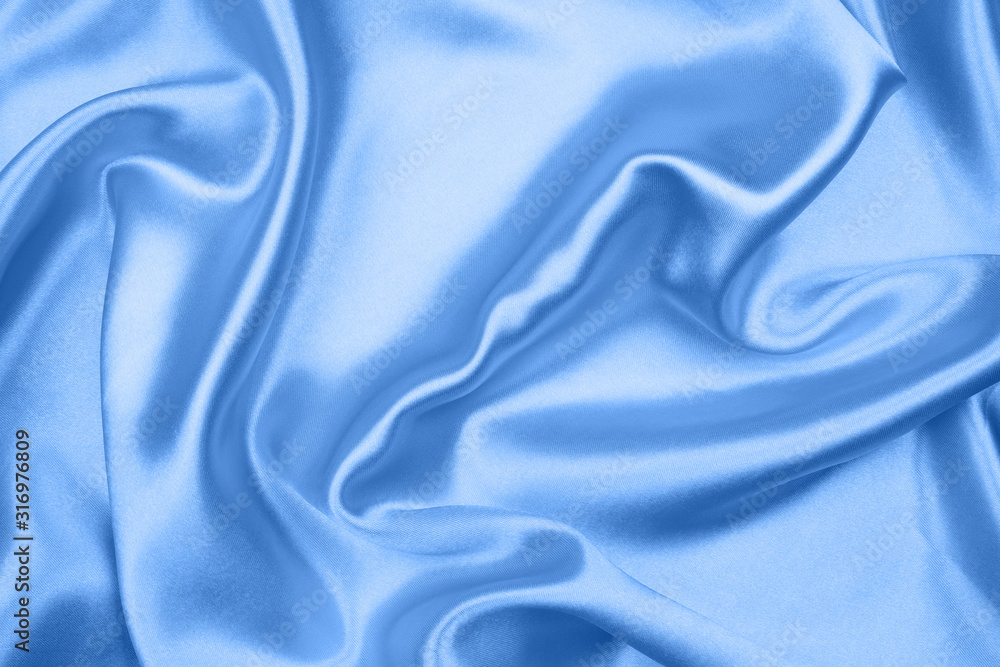 Fototapeta premium Smooth elegant blue silk or satin texture can use as abstract background, fabric