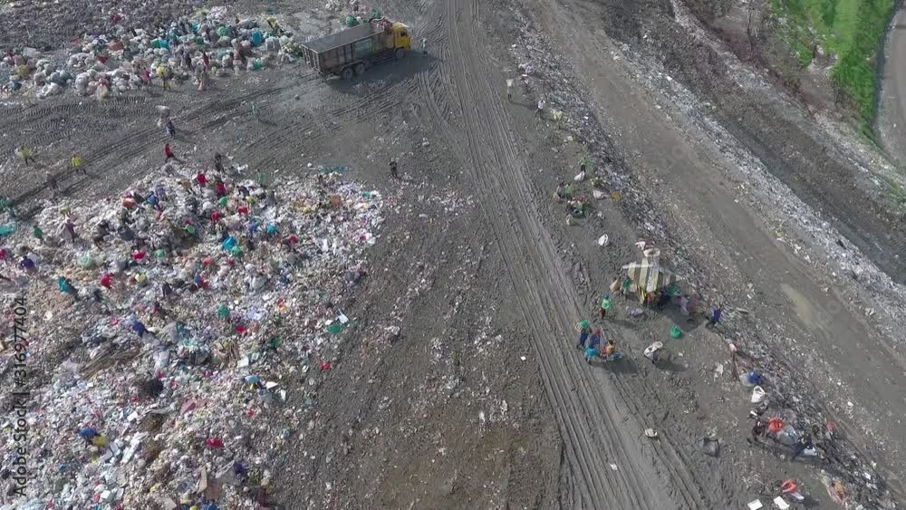 Aerial Shot Of Garbage And Scavengers Looking For Recyclable Items In Payatas Landfill Aerial Shot Of Garbage And Scavengers Looking For Recyclable Items In Payatas Landfill