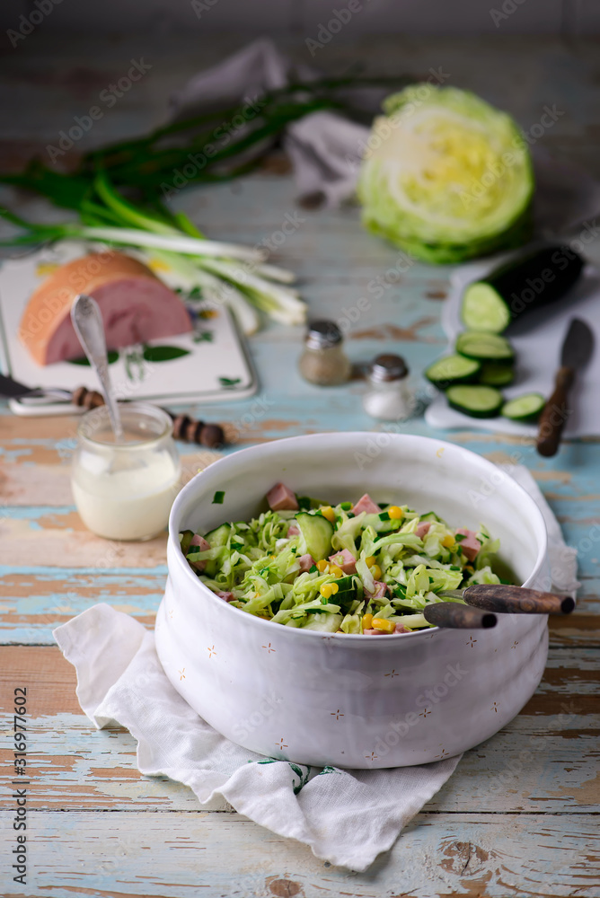 cabbage ham salad in ceramic bowl. selective focus cabbage ham salad in ceramic bowl. selective focus