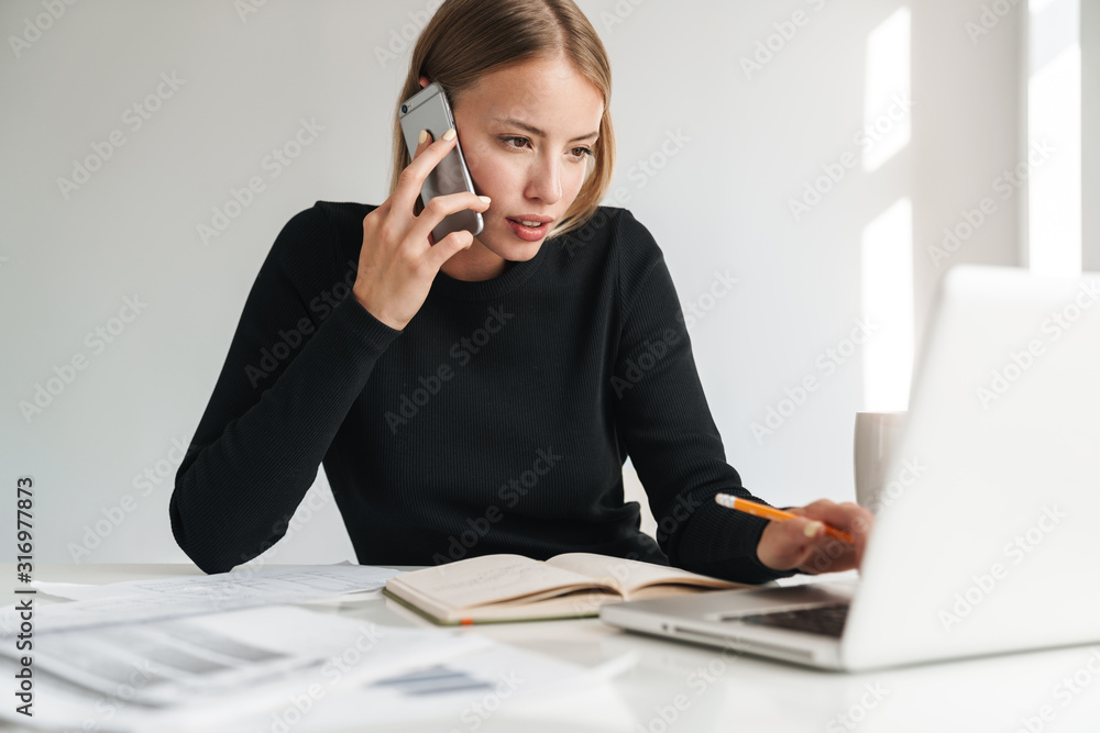 Business woman talking by mobile phone. Business woman talking by mobile phone.