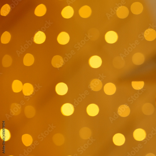 Abstract golden glitter background with gold Christmas decorations light, baubles and stars