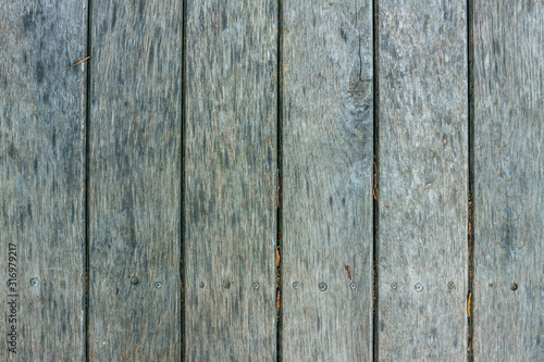 Old textured discoloured wooden boards Old textured discoloured wooden boards arranged vertically