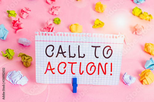 Writing note showing Call To Action. Business concept for exhortation do something in order achieve aim with problem Colored crumpled papers empty reminder pink floor background clothespin photo