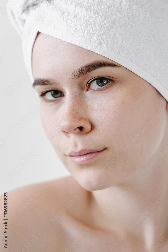Young Woman with white Towels. Spa, skincare, beauty, cosmetics, wellness concept Young Woman with white Towels. Spa, skincare, beauty, cosmetics, wellness concept
