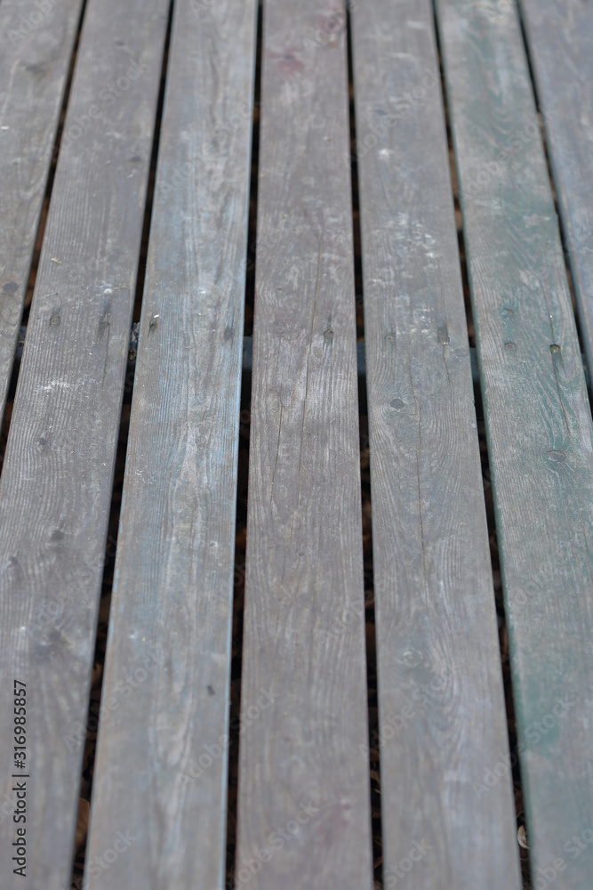 Textured surface of wooden boards with screws