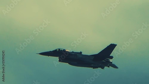 F-16 fighter over the clouds