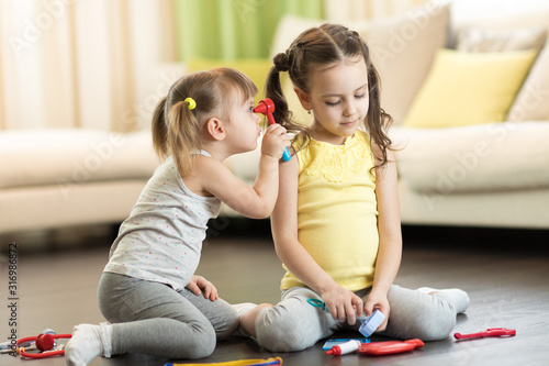 Funny kids playing doctor w...