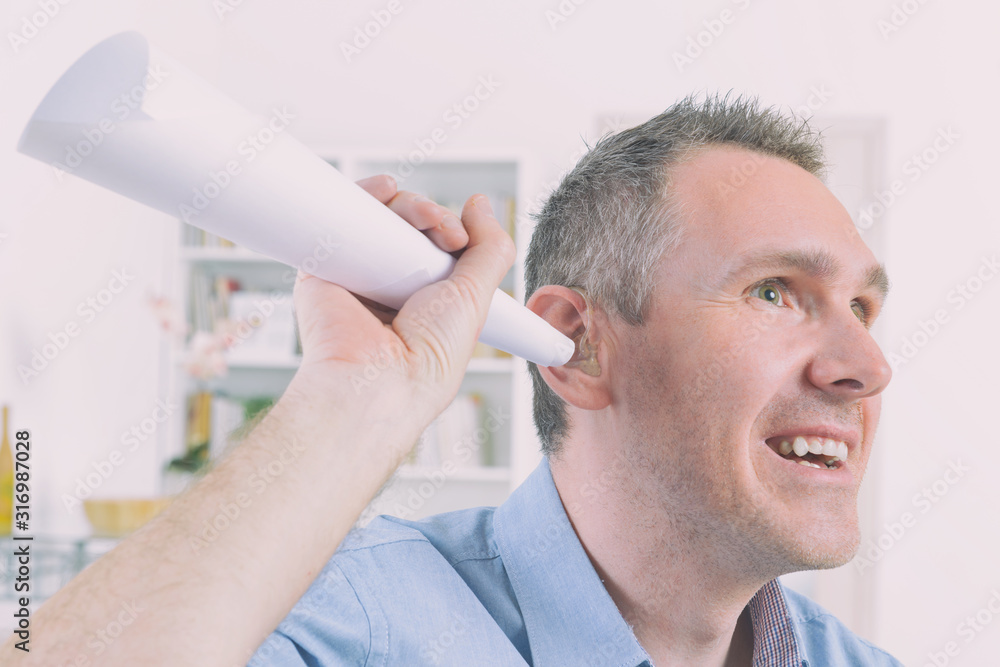 Fototapeta premium Man wearing deaf aid