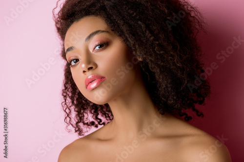 portrait of pretty african american girl on pink