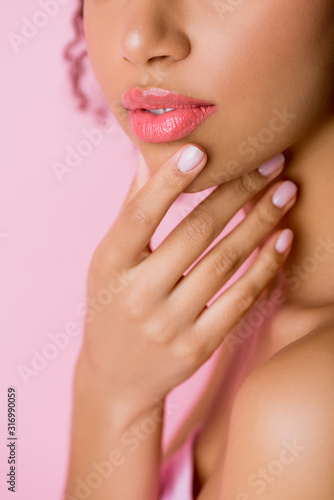 cropped view of beautiful tender african american girl touching face  isolated on pink
