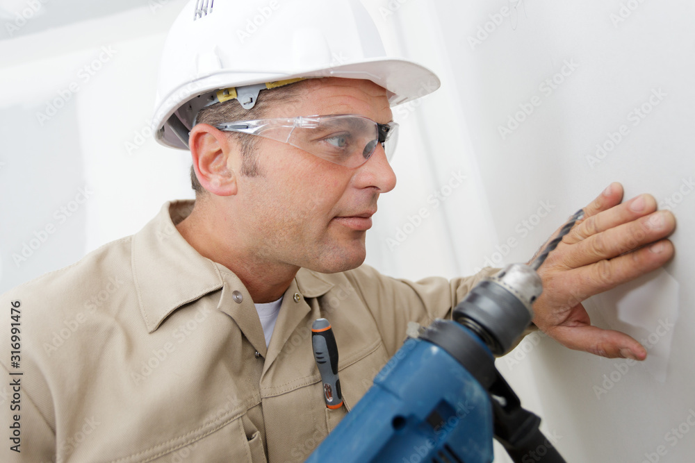 worker before laying the electrical wiring worker before laying the electrical wiring