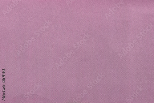 Cardboard pink abstract pattern texture close-up. Retro old paper background. Grunge concrete wall. Vintage blank wallpaper.