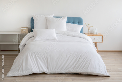 Obraz na plátně Interior with white bed linen on the sofa