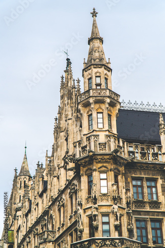 The New Town Hall, Neues Rathaus on Marienplatz main square, city government building with a tower clock. Gothic style. Photographed from below. Close up shot, texture