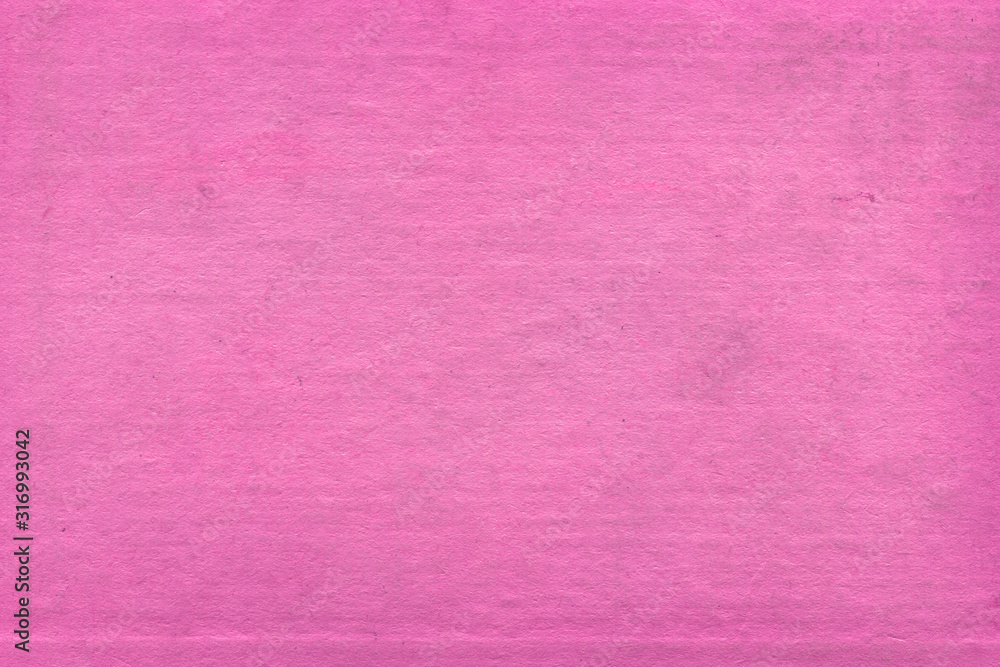 Fototapeta premium Cardboard pink abstract pattern texture close-up. Retro old paper background. Grunge concrete wall. Vintage blank wallpaper.