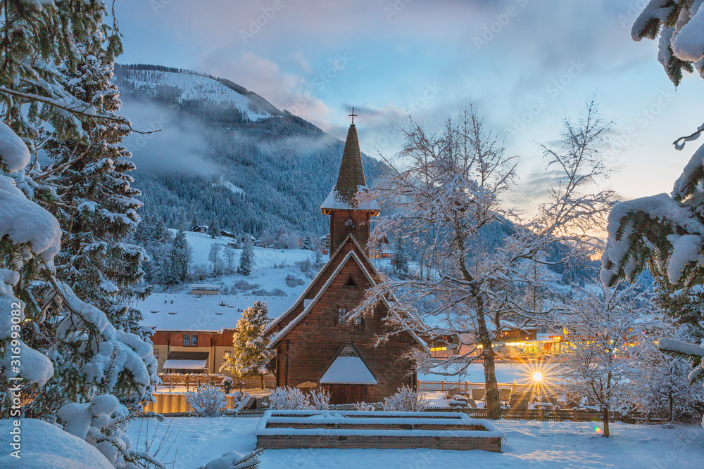 Winter view of the Evangelican church in Bad Kleinkirchheim at twilight, Carinthia, Austria, Europe Winter view of the Evangelican church in Bad Kleinkirchheim at twilight, Carinthia, Austria, Europe