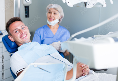 Man in dental chair waiting for examination