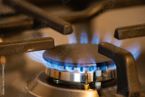 Close up of gas hob burner on cooker in kitchen.