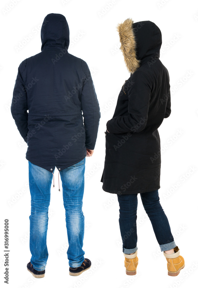 Back view of couple in winter jacket. Back view of couple in winter jacket.