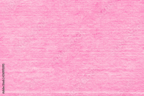 Cardboard pink abstract pattern texture close-up. Retro old paper background. Grunge concrete wall. Vintage blank wallpaper.