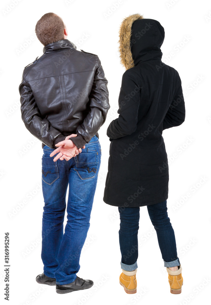 Back view of couple in winter jacket. Back view of couple in winter jacket.