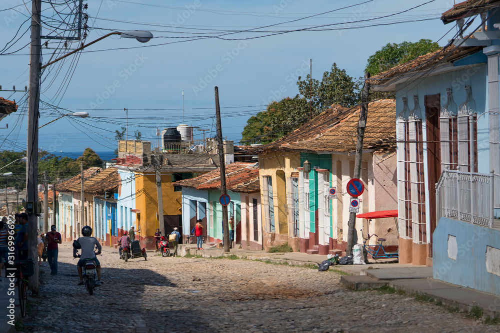 old trinidad street with many colorful houses and people, cuba old trinidad street with many colorful houses and people, cuba