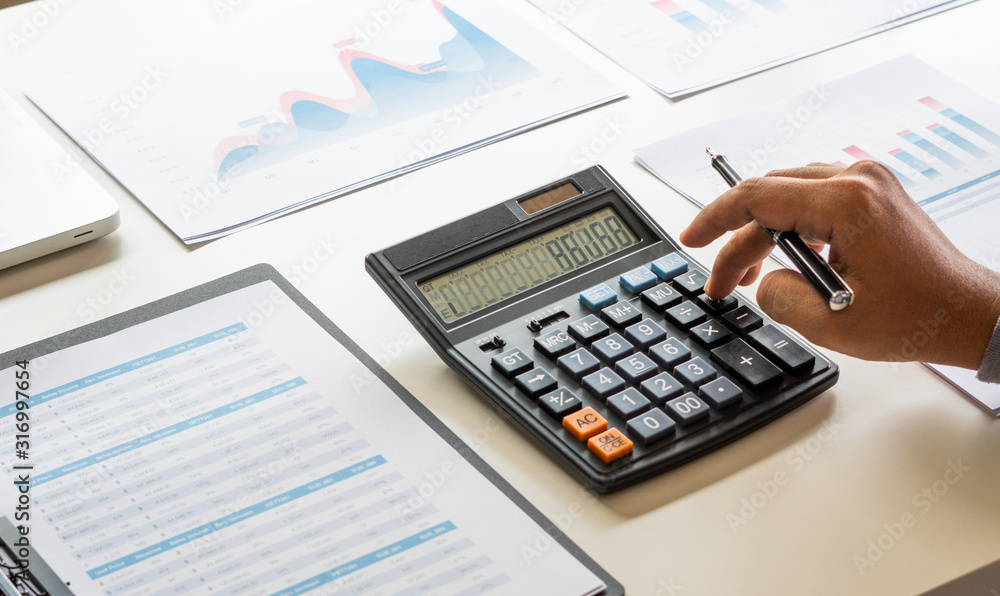 businessman working calculate data document graph chart report marketing research development planning management strategy analysis financial accounting. Business office concept. businessman working calculate data document graph chart report marketing research development planning management strategy analysis financial accounting. Business office concept.