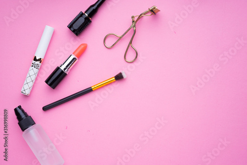 Fototapeta Naklejka Na Ścianę i Meble -  Creative arrangement of cosmetics products on pink background.