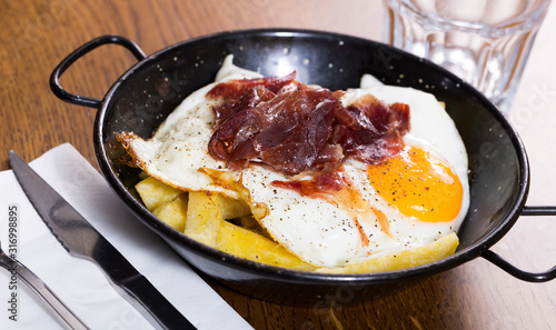 Wallpaper Mural Broken fried eggs with Iberico ham Torontodigital.ca