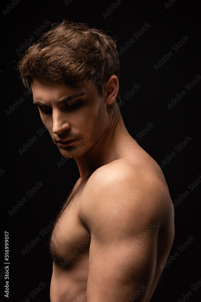 sexy man with bare muscular torso isolated on black sexy man with bare muscular torso isolated on black