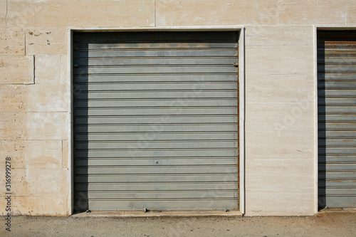 metal garage door in the marble wall
