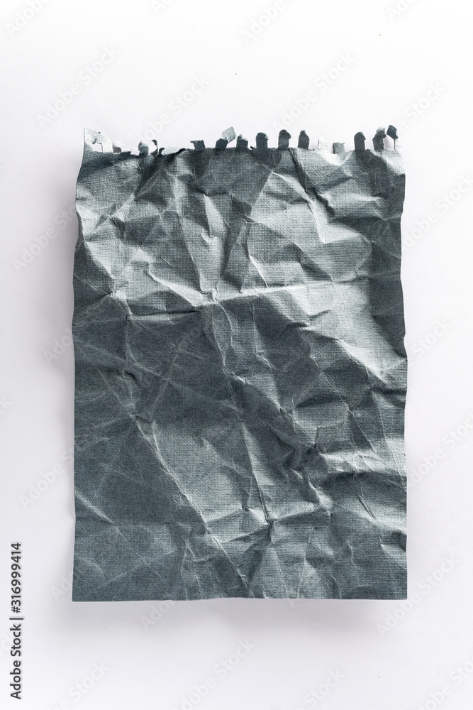 Obraz premium crumpled ball of gray paper on a white background. crumpled paper on white mocap paper