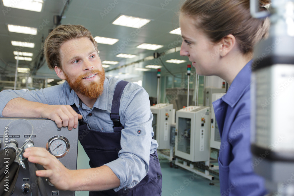 industrial man and woman engineer in factory industrial man and woman engineer in factory