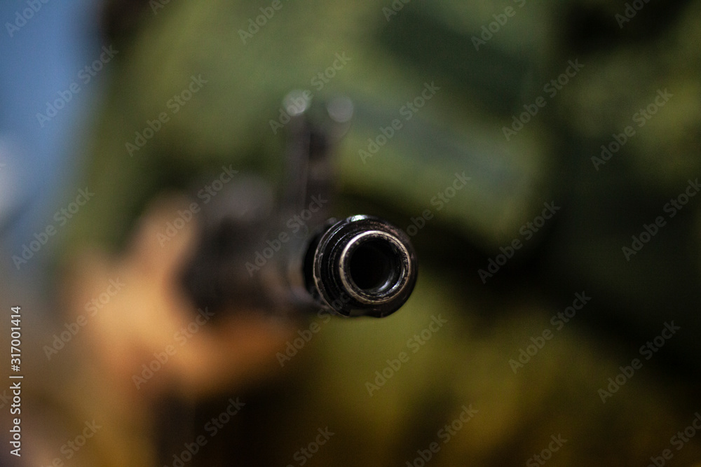 The barrel of an assault rifle. The weapon in the hands. Firearms in combat condition. Kalashnikov assault rifle. Training soldiers. Military subjects. For lovers of military training. The barrel of an assault rifle. The weapon in the hands. Firearms in combat condition. Kalashnikov assault rifle. Training soldiers. Military subjects. For lovers of military training.