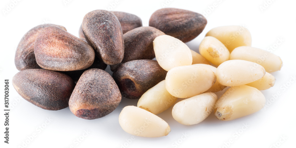 Pine nuts on the white background. Organic food. Pine nuts on the white background. Organic food.
